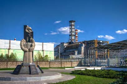 Chernobyl Monument and Reactor April 2012 Photo by Matt Shalvatis https://creativecommons.org/licenses/by-nc-sa/2.0/